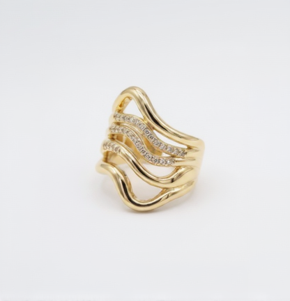 Gold ring with diamond accents plain background
