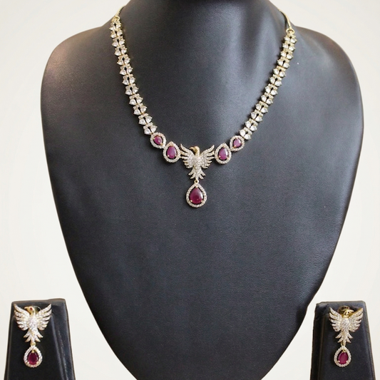 Necklace and earrings set on a black mannequin bust with a white background