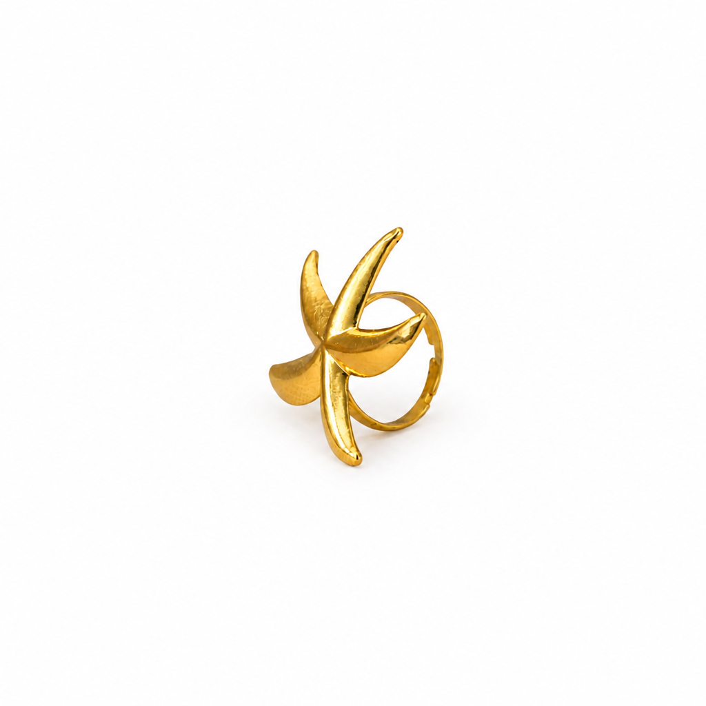 Gold ring with a unique design on a white background