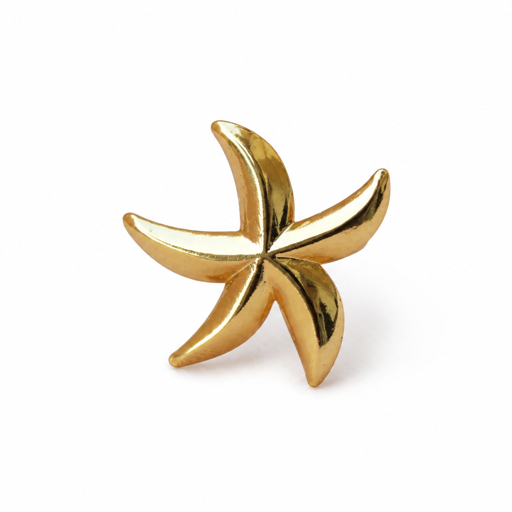 Gold starfish-shaped earring on a white background