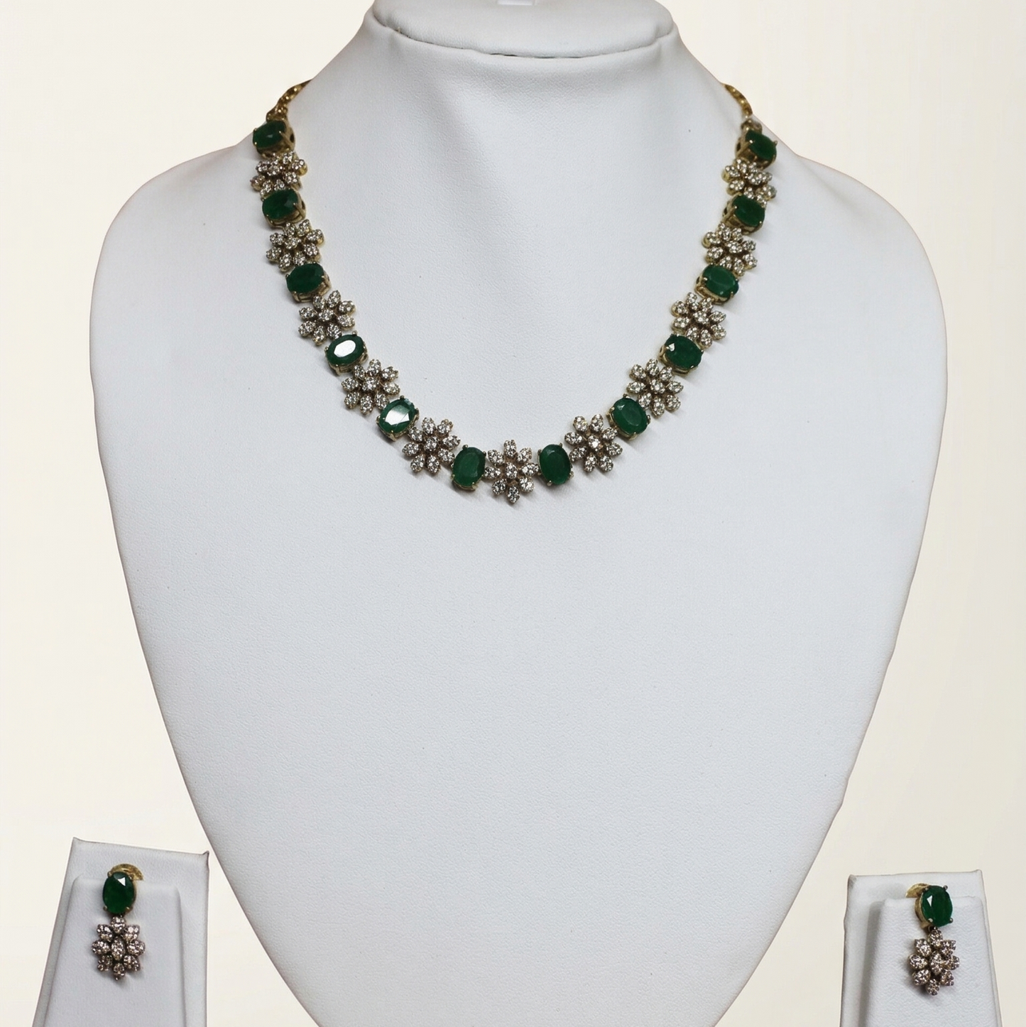 Jewelry set with necklace and earrings on a white mannequin bust