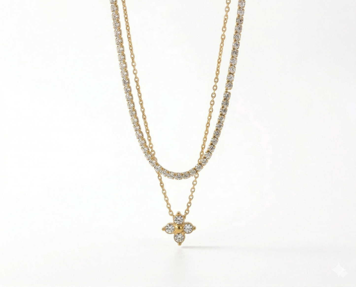 Two gold necklaces with diamond pendants on a white background