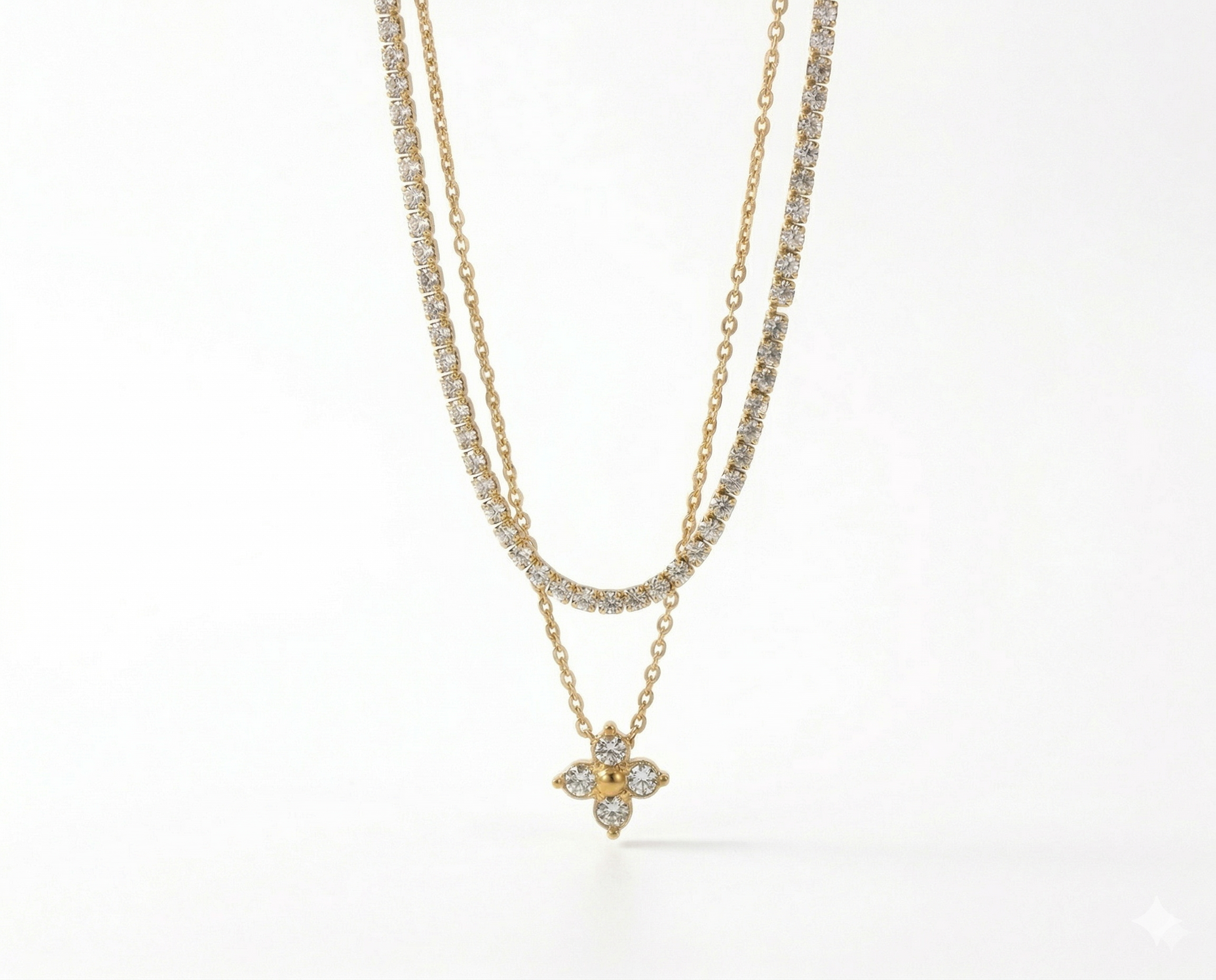 Two gold necklaces with diamond pendants on a white background