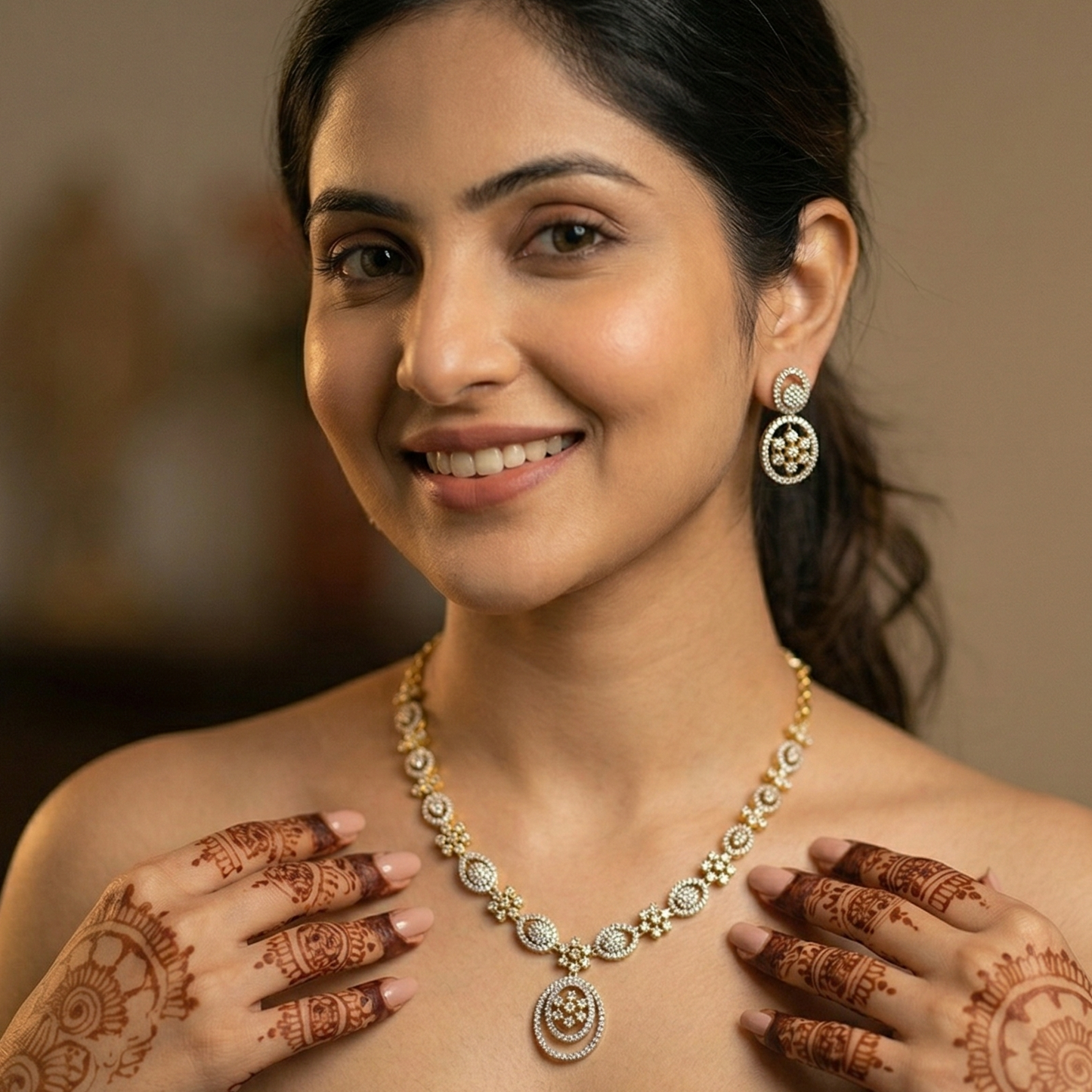 Woman wearing a necklace with henna designs on her hands and shoulders.